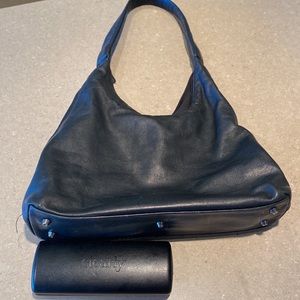Danier leather purse.  GUC.  Size shown against sunglass case
